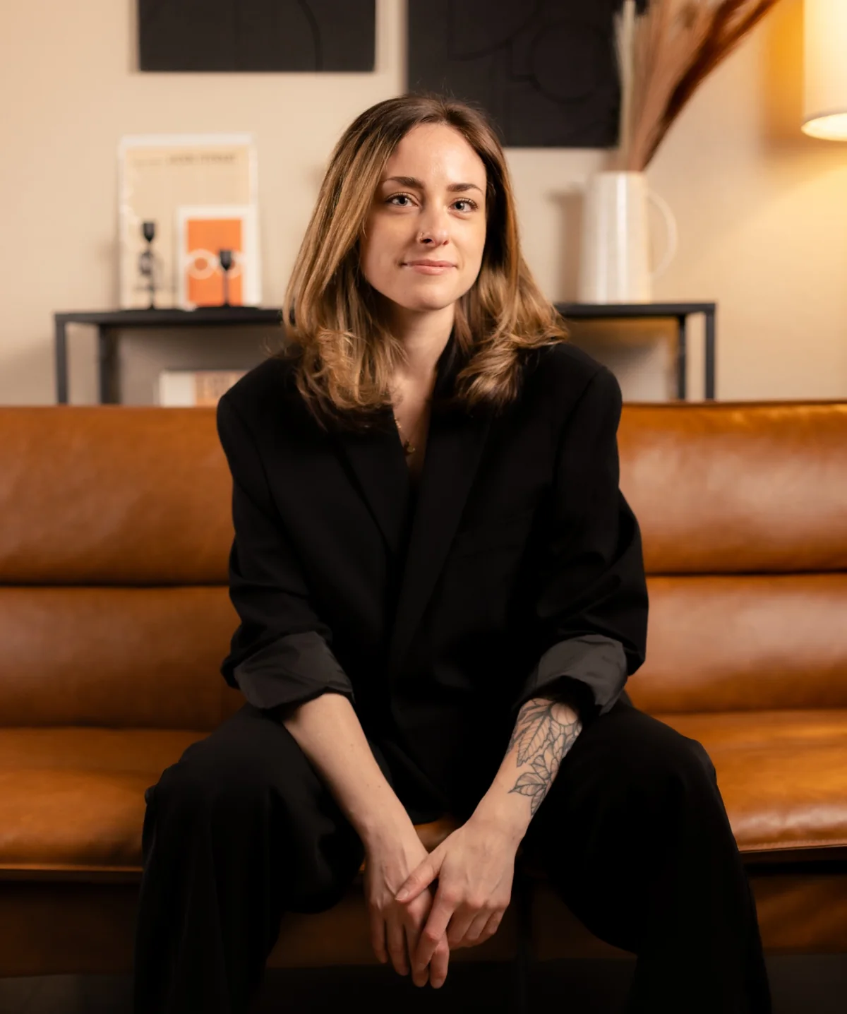 Madeline Narlock, founder of Nightshift Planning Co., seated in a lounge